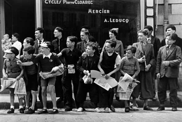 watching-the-tour-de-france-in-front-of-the-bicycle-shop-owned-by-pierre-cloarec-one-of-the-cyclists-in-the-race-pleyben-brittany-france-july-1939
